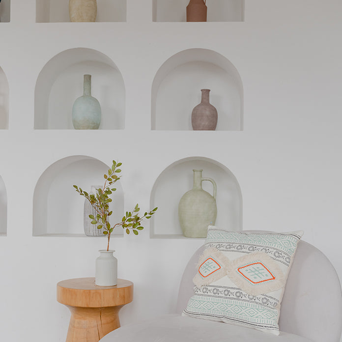 Coussin à pompons style bohème